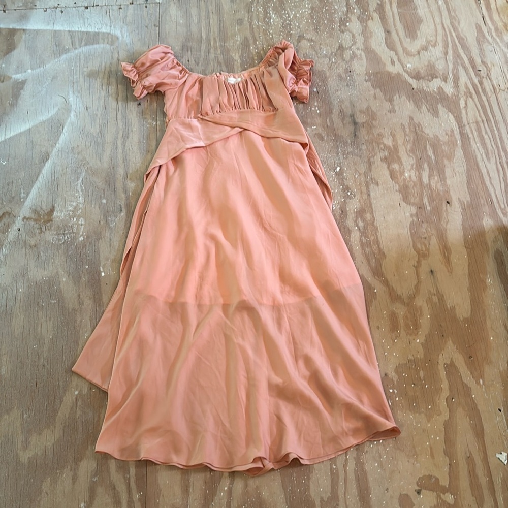 Orange long flowy dress, ties in the back.